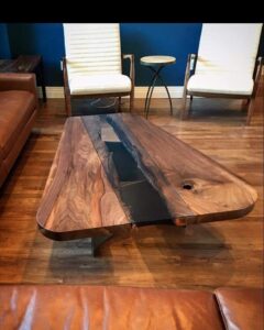 Live edge coffee table made of walnut glass and rolled steel