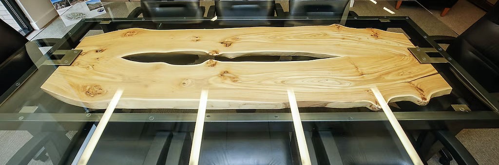 Glass topped floating slab conference table.