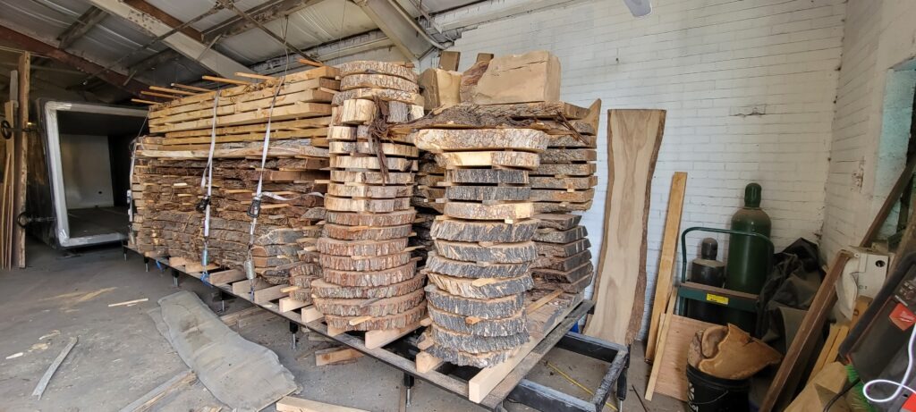 Stack of wood slabs ready to go into the kiln