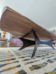 Live edge wood slab coffee table with laser cut base
